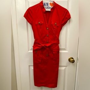 Red utility/shirt dress with a belt. Front pockets. Fits slim.